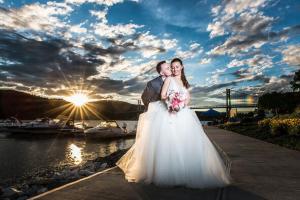 wedding couple standing near the river